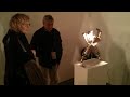 'Treasuring the Particle' robot hands cherish a particle at Kinetica Art Fair