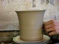 Throwing a clay pottery flower plant pot on a potters wheel demo how to pot ...