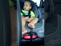 Funny baby in car seat