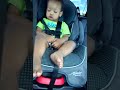 Funny baby in car seat