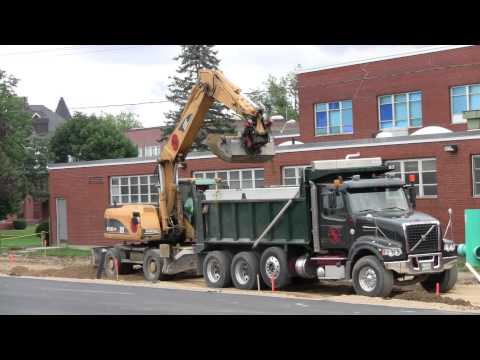 Cat M318C Unloading Dump Truck rabbitsmeller400 1744 views