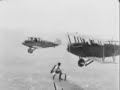 Gladys Ingle of the 13 BLACK CATS changes planes in mid-air