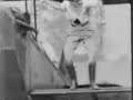 Gladys Ingle of the 13 BLACK CATS changes planes in mid-air