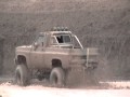 Lifted chevy 4x4 80's tearing up the field