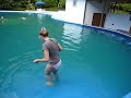 Woman swims in t-shirt and nickers