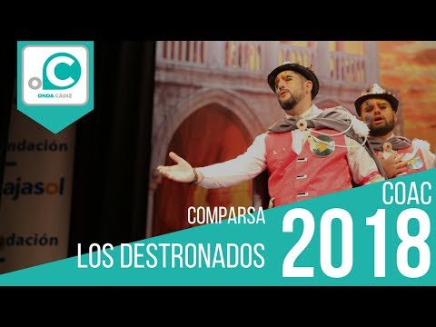 La agrupación Los destronados llega al COAC 2018 en la modalidad de Comparsas. En años anteriores (2017) concursaron en el Teatro Falla como El hombre de los mil rostros, consiguiendo una clasificación en el concurso de Preliminares. 
