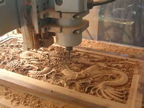CNC Router cutting the Wood Dragon mad from hardness wood from Thailand. HHq8PwqxHa4