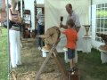 Ian Sanders carving a Tree Table at Childwickbury Arts Fair