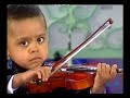 Andre Rieu & 3 year old violinist, Akim Camara 2005