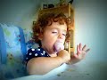 funny baby falling asleep while eating ice-cream