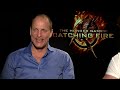 Woody Harrelson & Liam Hemsworth talk socks, cracking feet and Hunger Games