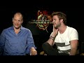 Woody Harrelson & Liam Hemsworth talk socks, cracking feet and Hunger Games