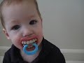 The Funny Baby With His Pacifiers