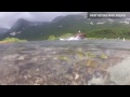 Watch grizzly bear try to eat camera