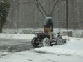 4 WHEEL DRIVE ATV WITH PLOW BLADE PLOWING SNOW