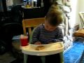 Funny sleeping baby in high chair