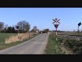 A Danish IC3 train passes railroad crossing nearby Radbjerg