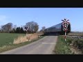 A Danish IC3 train passes railroad crossing nearby Radbjerg