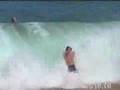 Non-surfer gets slammed by a wave