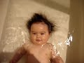 Funny baby in tub, amazing magical hair