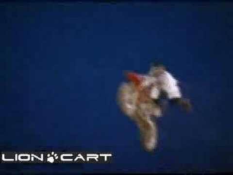 motorcycle jumps huge jump and crashes. Rider attempts a superman during the 