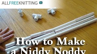 Makeshift niddy noddy I used a cardboard roll and two knitting needles.
