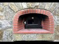 Outdoor fireplace with wood burning pizza oven