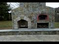 Outdoor fireplace with wood burning pizza oven