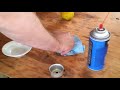 Clean out Toro lawnmower carburetor jet