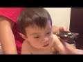 Funny baby talking on the phone