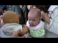 Baby Maya talking to doll