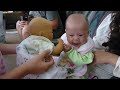 Baby Maya talking to doll