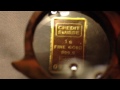 1 gram credit Suisse gold bar close examination and weigh