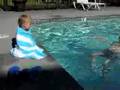 Deaf baby son watches dad swim