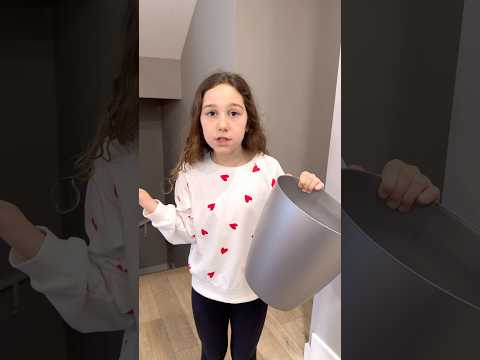 Kids learn to throw trash in a trash bin