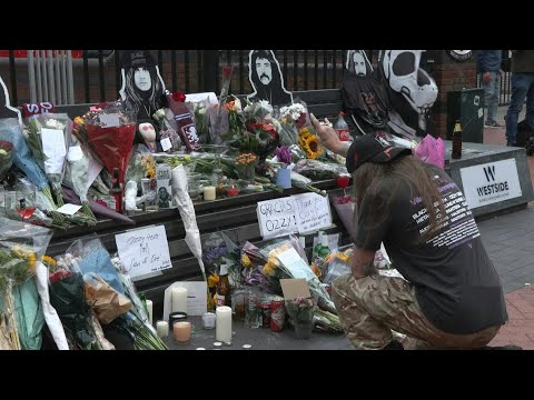 Ozzy Osbourne fans lay flowers on 'Black Sabbath Bridge' in Birmingham | AFP