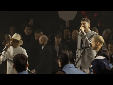 Pharrell Williams performs with Mumford and Sons at his sophomore collection for Louis Vuitton
