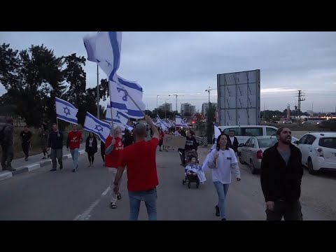 Israelis protest near Sderot on Monday, demanding the offensive against Hamas continues