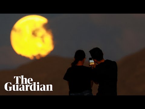 Supermoon with partial lunar eclipse charms stargazers across the world