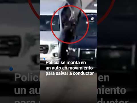 Policía se monta en un auto en movimiento para salvar a conductor