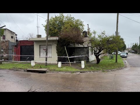 Police cordon outside house where the bodies of three Argentine women were found | AFP