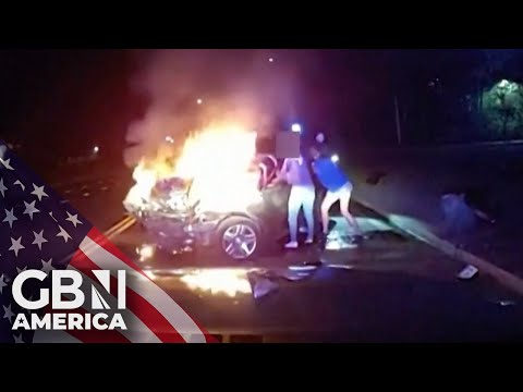 Officer rescues person moments before car is engulfed in flames in suspected drunk driving incident