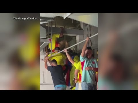 Fans at Argentina Colombia matchup Copa America force their way through the gates before the game