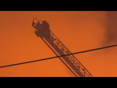 A large fire continues burning in Dallas, damaging six buildings