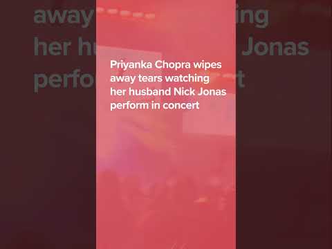 Priyanka Chopra wipes away tears watching her husband Nick Jonas perform during Jonas Brothers show