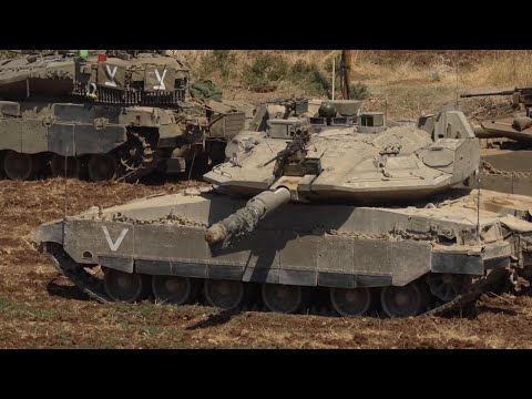 Israeli tanks and armored vehicles stationed near the country's border with Lebanon