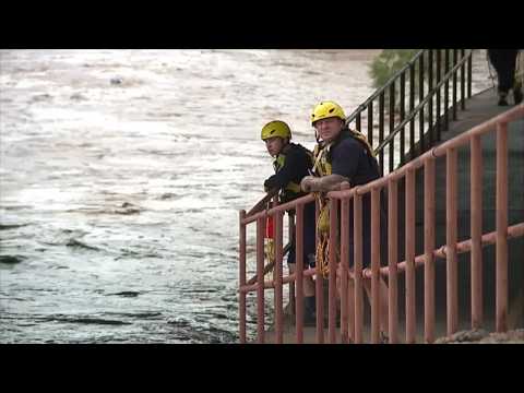 Rescue Crews search for man swept into Santa Cruz River