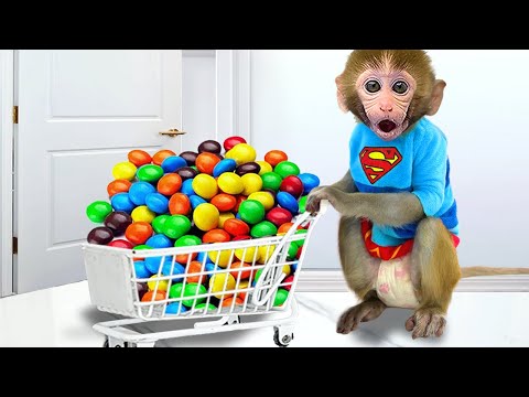 Monkey Baby Bon Bon go to supermarket to buy colorful chocolate candy and eat rainbow ice cream