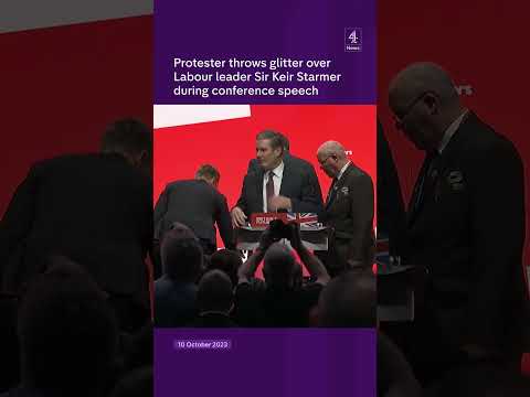 Protester throws glitter over Labour leader Starmer during conference speech.