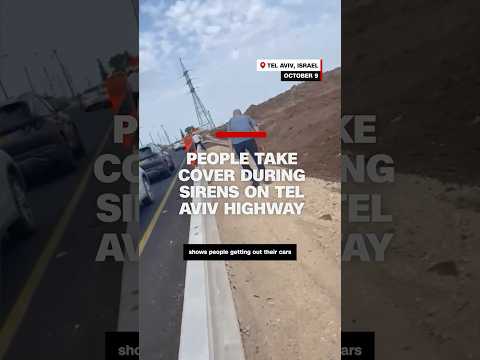 People take cover on Tel Aviv highway